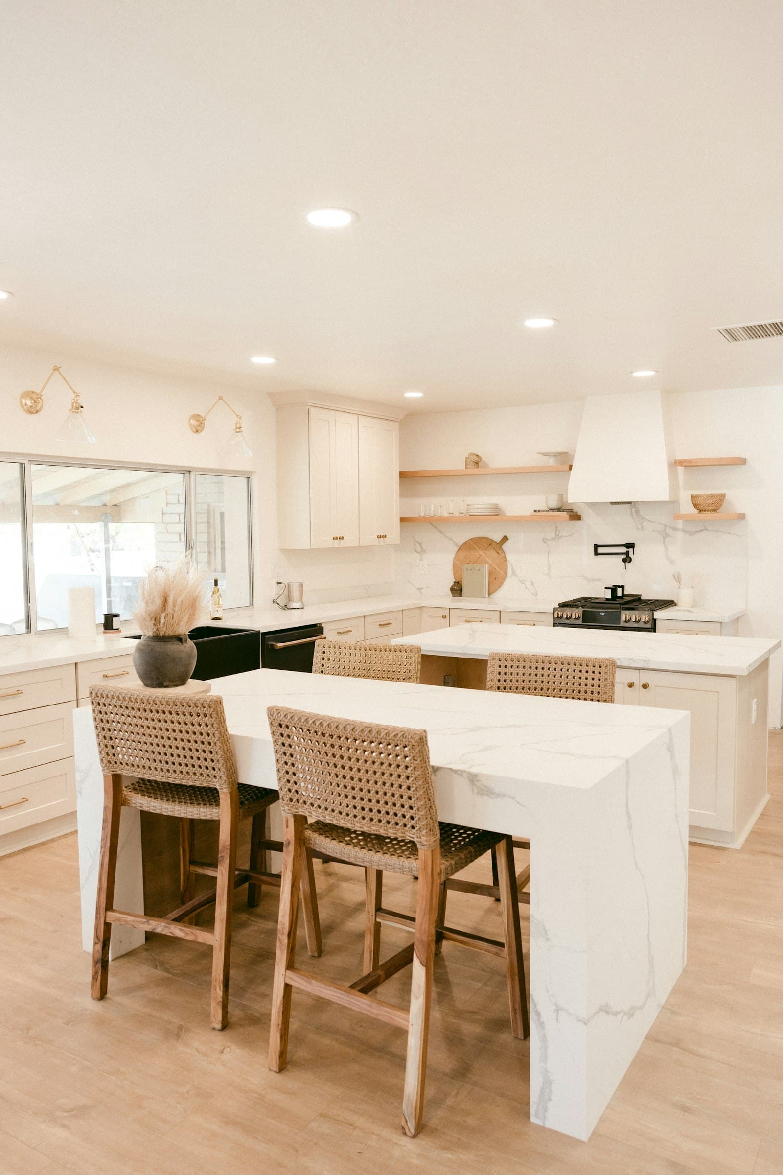 Remodeled Lincoln Park kitchen with marble counters, island seating, and custom cabinetry